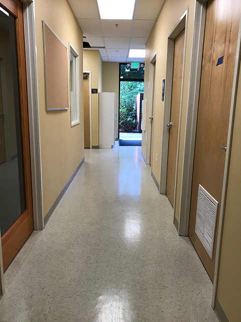 Looking down the long halls of the office toward treatment rooms
